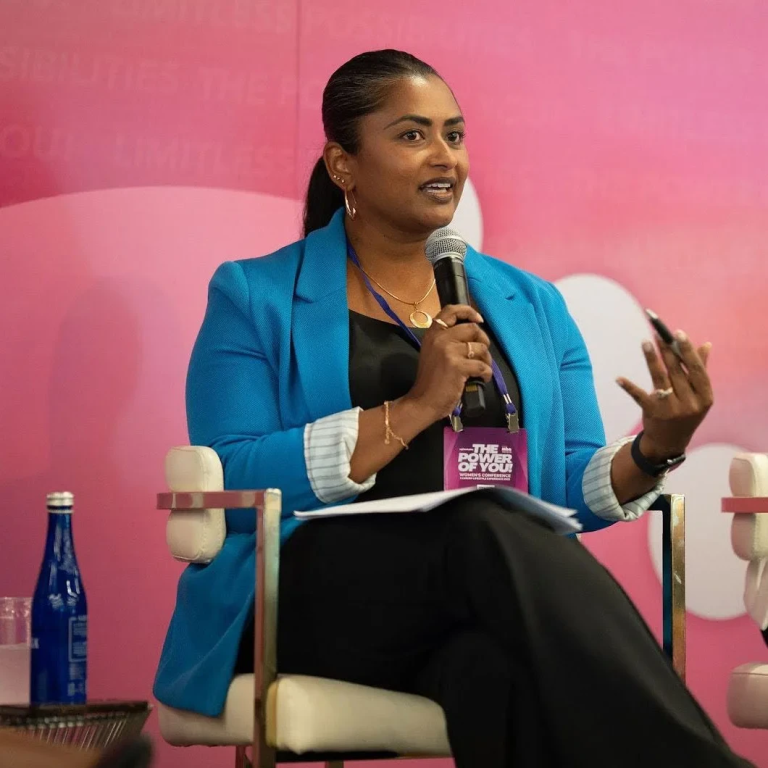 Dr-Razia-Aristide-at-a-Conference.webp